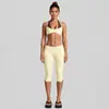 Conjunto de ropa de yoga transfronterizo con hermoso cuello halter en la espalda, sujetador deportivo de color contrastante, pantalones capri deportivos para correr al aire libre, conjunto de fitness