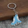 Chaveiro de patins laranja direto da fábrica transfronteiriço liga de zinco personalidade da moda chaveiro de patins por atacado