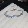 [Cadena de Diamantes Arcoíris] Pulsera de extracción de zircón trenzado en cruz, una pulsera lujosa y de alta gama, una pieza de joyería delicada y de moda