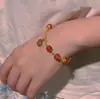 Nuevo brazalete de ágata roja celebridad de internet verano brazalete de campana de la suerte femenino alta calidad personalidad estilo antiguo hada blanco mano