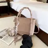 Bolsa de Mão Estilo Coreano Ins Exquisita Versátil Formato de Balde Feminina 2026 Nova Simples Personalidade Casual Ombro Transversal