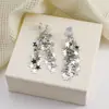 Atmósfera de Otoño e Invierno Estrella Plateada Borla Clip para Oreja Sin Perforar para Mujer Diseño de Nicho Pendientes Elegantes Versátiles de Alta Gama
