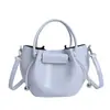 Bolsa Saco Estilo Coreano para Mulheres 2026 Novo Modelo Bolsa de Mão Bolsa Transversal de Ombro Design de Nicho Casual Elegante Bolsa de Estilo Simples