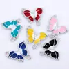 Ventas Directas del Fabricante Transfronterizas Personalizado Mariposa Blanco K Doble Colgante Accesorios DIY Aleación de Metal con Goteo de Aceite Joyería Colores Mixtos