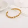 Pulsera tejida de moda transfronteriza al por mayor Accesorios de diseño simple original europeo y americano Pulsera abierta chapada en oro Pulsera
