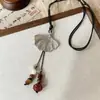 2025 Cuerda trenzada retro hoja pez gordo borla atmósfera de otoño collar borla collar elegante
