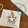 Colar Boho Artesanal Tecido Estrela-do-Mar e Concha para Mulheres 2026 Novo Estilo de Férias Acessório de Corrente Longa para Pescoço da Moda