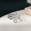 Joyería de diseño creativo y único con cuenta de símbolo de infinito giratoria, adecuada tanto para hombres como para mujeres, se puede usar como anillo