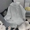Estilo europeo y americano, inspirado en Corea, sudadera con capucha de corte relajado y hombros caídos, de color liso, diseño básico, bolsillo tipo canguro, corte holgado y efecto adelgazante, sudadera casual