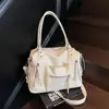 Bolso tote de moda popular transfronterizo, bolso de hombro y cruzado de alta gama de gran capacidad para mujer, versátil y moderno para comercio exterior