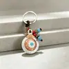 Colgante de bolsa giratorio de nueve casillas de doble cara estilo étnico, llavero, colgante, accesorio, regalo pequeño, al por mayor