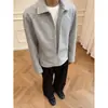 Sudadera minimalista de otoño estilo dos piezas falsas con cremallera para hombre y mujer, corte holgado con un elegante diseño de cuello, chaqueta casual gris de alta gama