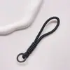 Correa de Muñeca Trenzada Estilo Ins Lanyard Nudado Cuerda Corta de Silicona Colgante Antiperdida para Teléfono Dopamina