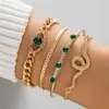 Conjunto de Pulseiras de Joias Transfronteiriças Moda Nicho Cravejado de Diamantes Pedra Preciosa de Olhos Verdes Pulseira Aberta Personalizada em Forma de Cobra Conjunto de Quatro Peças para Mulheres