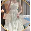Traje de vestido floral suave de longitud media para mujer, nuevo cárdigan fino de verano con protección solar, dulce falda de tirantes