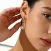 Brincos Pingente de Girassol Europeus e Americanos Retrô de Nicho Estilosos e Modernos em Aço Inoxidável Banhado a Ouro 18K Incrustados com Diamantes para Mulheres