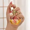 Llavero con Arena Líquida en Botella de Aceite, Botella que Brilla en la Oscuridad, Llavero de Ballena, Colgante Exquisito para Bolso, Lindo Accesorio para Llavero