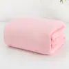 Toalla de baño de forro polar de coral engrosada y ampliada color liso 105*200 toalla envolvente de absorción de agua para adultos transfronteriza se puede etiquetar