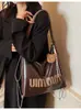 Bolsa Tote Transfronteriza para Mujer, Gran Capacidad, Nuevo Bolso Cruzado de Hombro con Cadena de Nicho Otoño e Invierno 2026, Mochila Multifuncional