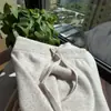 Calça de malha de lã espessa de perna reta para mulheres, nova coleção outono/inverno 2026, corte afina a silhueta, cintura elástica, tecido macio e fluido, estilo wide leg, moderna