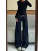 Calça Jeans Micro Flare Azul Escuro para Mulheres Outono 2026 Nova Cintura Baixa Estilo Garota Picante Não Apertada Calça Flare Emagrecedora