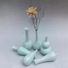 Jarrón de cerámica de Jingdezhen Esmalte blanco azul flor Botella Guanyin adornos artesanales flor pequeña una generación