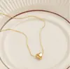 Collar Versátil de Moda Coreana Corazón Melocotón Corazón Ins Nicho Diseño de Lujo Ligero Aleación Forma de Corazón Nuevo Accesorio