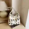 Bolso de hombro nuevo y elegante 2026, con un diseño texturizado, aspecto moderno, gran capacidad y un estampado floral. Este es un bolso tote simple y chic para mujer