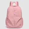Venta al por mayor transfronteriza de mochilas sencillas y casuales, ligeras y a la moda, adecuadas para estudiantes de secundaria y preparatoria, e ideales para viajar