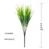 Manojo de Hierba de Primavera Simulada 7 Horquillas 28 Hierbas Césped Artificial Planta Verde Decoración Suave Decoración de Jardinería de Ingeniería Césped de Plástico Venta Directa de Fábrica