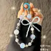 Nueva Cadena para Teléfono Móvil con Lazo de Pedrería Colgante para Muñeca Moda Pequeño Aroma Cadena de Cuentas Colgante para Bolso Llavero