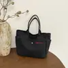 Bolsa de Lona 2026 Verano Nuevo Estilo Bolso de Mano Simple con Letras Estilo Coreano Versátil Informal Gran Capacidad Bolsa de Lona