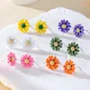 Accesorios populares europeos y americanos aretes de flor de margarita para mujer nicho simples frescos versátiles color aretes de flor aretes