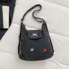 Bolsa de mezclilla multifuncional bordada con cachorro lindo 2026 nueva mochila/bolso de hombro casual de nicho de moda