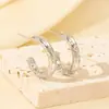 Pendientes Metálicos Populares de Lujo Transfronterizos Europeos y Americanos con un Toque de Alta Gama, Pendientes de Botón Florales Transfronterizos de Nicho
