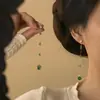 Pendientes de botón con borla de circón y pasador de plata estilo indiferente nicho alta gama moda simples personalidad versátil temperamento joyería para la oreja