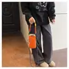 Bolso bandolera nuevo de color dopamina en bloques de color para teléfono, bolsa para botella de agua de viaje, mochila ligera para deportes al aire libre