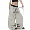 Fornecido diretamente pelo fabricante, calça de moletom curva listrada em cores contrastantes com estampa de letras estilo American Gothic, unissex, plissada, solta, perna larga.