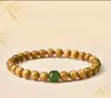 Pulsera de Hilo Único de Nanmu de Seda Dorada Estilo Montaña Putuo para Hombres y Mujeres Cuentas de la Suerte Cuentas Budistas Pulsera de Cuentas de Oración Regalo