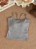 Top regata sem costas com design moderno e bojos, costas bonitas, sem mangas, feminino, verão 2026, slim fit, que valoriza a silhueta, camisola deslumbrante