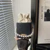 Bolso de Mano de Perlas Coreanas para Mujer 2026 Nuevo Otoño/Invierno Bolso de Hombro Único Cruzado de Moda de Gama Alta Bolso Cubo Versátil