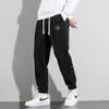 Calças masculinas de veludo cotelê para primavera e outono, calças esportivas, calças de moletom masculinas, folgadas e versáteis, calças casuais com retalhos, calças jogger, calças compridas