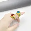 Anillo de esmalte bañado en oro de arena vietnamita, con un diseño de ciervo de nueve colores con gemas, de estilo nacional, ajustable y bañado en oro.