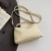 Bolso de mano de alta costura estilo coreano, bolso de hombro, nuevo modelo primavera 2026, bolso tipo almohada casual simple, bolso cruzado de nicho para mujer