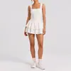 Falda corta de tenis sin espalda estilo europeo y americano, tacto nude, ajustada, anti-exposición para mujer, nueva falda corta transfronteriza para correr al aire libre, fitness, yoga