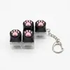 Chaveiro Botão Luminoso de Patinha de Gato Chave de Teclado Switch Tecla de Teclado Brinquedo Descompressão Pingente de Bolsa Chaveiro