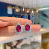 Anillo de corindón rojo de simulación Pendientes colgante collar de moda popular europea y americana Juego de pendientes de corindón rojo de imitación