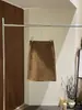 [Kai Pu] Trece Filas Otoño Francés Sencillo Relajado Doble Bolsillo Cuero Gamuza Longitud Media Versátil Falda Mujer BQA6197