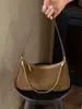 Bolso de hombro de diseño de nicho nuevo, bolso cruzado de alta calidad, bolso de hombro versátil y elegante, bolso de axila moderno para el día a día