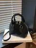 Bolsos para Mujer 2026 Primavera Nueva Moda Patrón de Cocodrilo Bolso de Hombro Cruzado Diseño de Nicho Bolso Retro de Concha